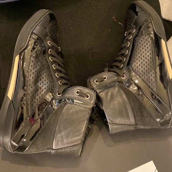 Authentic Versace High top Sneaks in fair condition. Black patent and leather